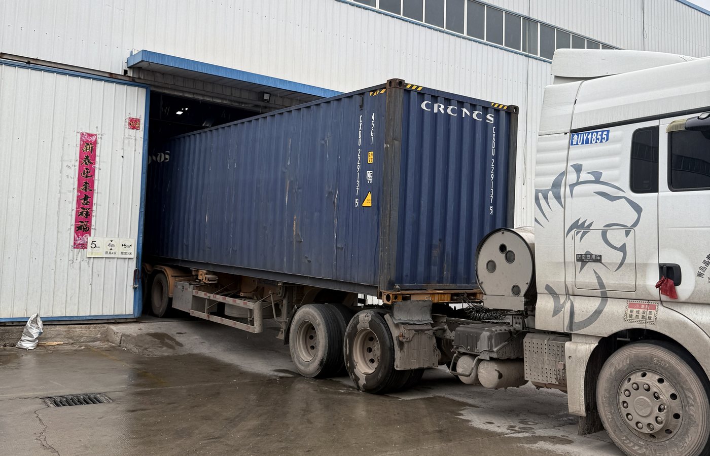 Container truck at irrigation product factory loading area